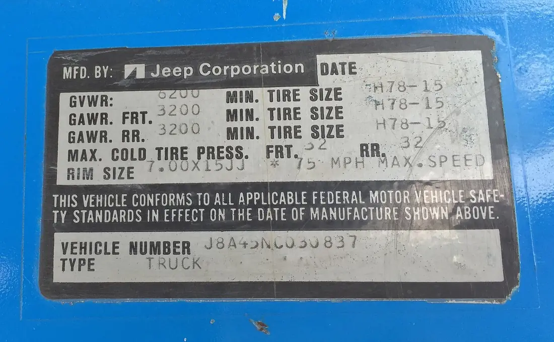 Certification label on a 1978 Jeep truck showing GVWR 6200, GAWR 3200 front and rear, tire sizes, pressures, and VIN.